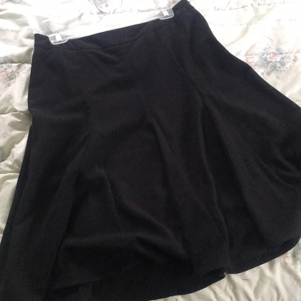 Pleaded knee length black A-Line skirt.